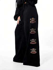 SUMWON X PAUL FRANK SUMWON WOMEN Pantalones de chándal anchos con pierna ancha y gráfico grande para mujer, pantalones de chándal casuales con aplicación de mono de strass y cordón - Negro - Ver 1
