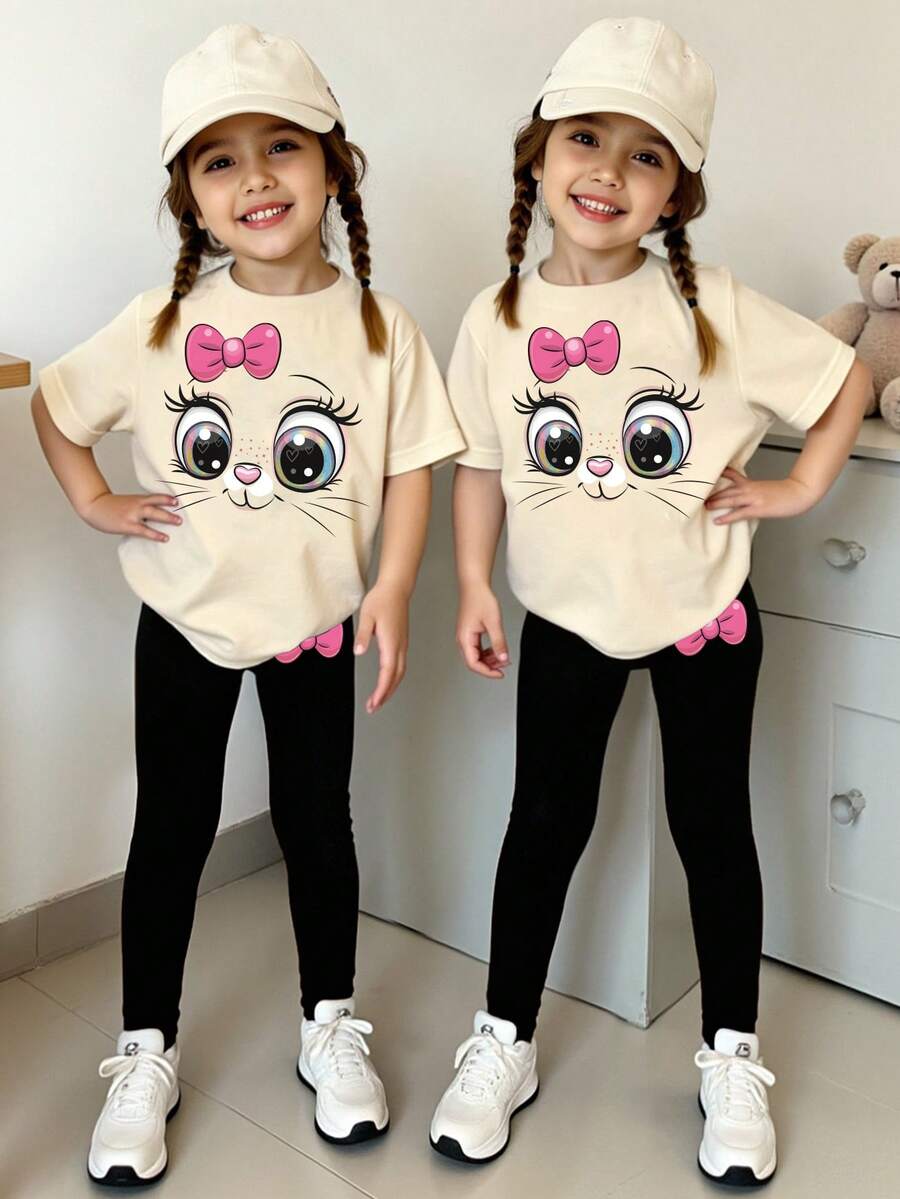 SHEIN Bộ đồ 2 mảnh thời trang thường ngày mùa xuân hè, sáng tạo, in hình mặt mèo dễ thương, trái tim và nơ, gồm áo thun và quần legging, thoải mái cho bé gái mặc hàng ngày, phù hợp cho mùa xuân, hè và thu. - Nhiều màu - Xem 1
