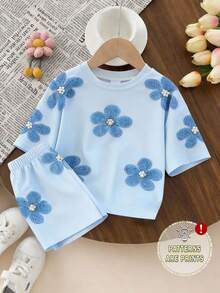 SHEIN 1 Set Niñas Bebé Casual Cómodo Moda Dulce Lindo Estampado Floral Camiseta de Manga Corta y Conjunto de Pantalones Cortos, Atuendos de Primavera a Verano, Conjunto de Verano Fresco Color Azul Claro - Multicolor - Ver 1