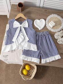 Bộ đồ cho bé gái tuổi teen: Áo không tay kẻ caro có bèo nhún và nơ trang trí, kèm quần short. - Nhiều màu - Xem 2