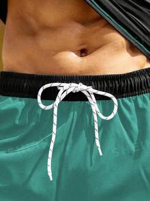 Manfinity KASUA Conjunto de 2 piezas de traje de baño para hombre con parte superior de manga raglán de color contrastante y pantalones cortos de natación, para vacaciones - Multicolor - Ver 5