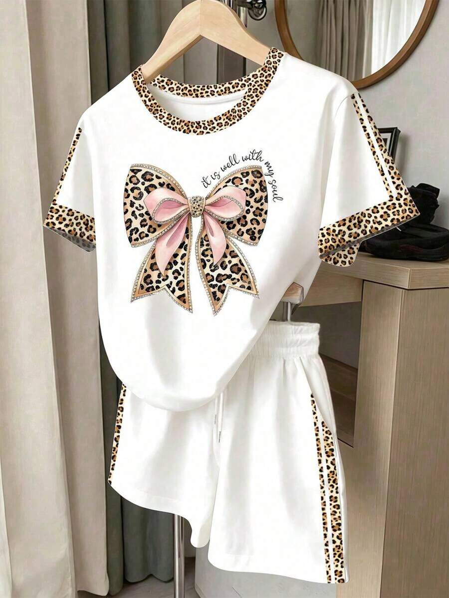 Resyla Bộ 2 món áo ngắn tay cổ tròn màu trắng có nơ và quần short dành cho nữ mùa hè. - trắng - Xem 1