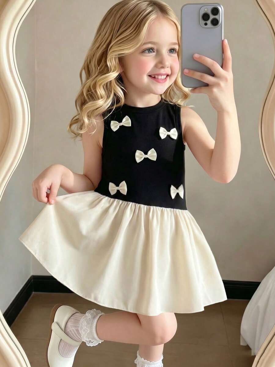 1 chiếc đầm bé gái kiểu dáng thường ngày, cổ tròn, nơ 3D dễ thương, không tay, chất liệu nhẹ, phối màu tinh tế, phong cách ngây thơ, mềm mại, tối giản, đa năng, phù hợp cho đi chơi, hoạt động ngoài trời, đi học, nghỉ mát và mặc hàng ngày. - Nhiều màu - Xem 1