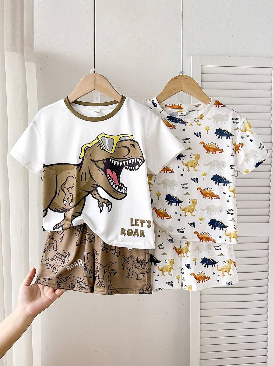SHEIN Conjunto de 4 piezas de camiseta de manga corta con cuello redondo y estampado de dinosaurios de dibujos animados, y pantalones cortos para niño pequeño, adecuado para el verano - Multicolor - Ver 1