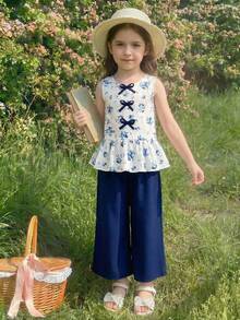女童春夏休闲时尚新款套装，纯色藏蓝色上衣，正面饰有3D蝴蝶结，无袖圆领半开襟衬衫，下摆饰有荷叶边，搭配纯色藏蓝色梭织长裤，两件套，可爱舒适的休闲套装，适合日常穿着、上学、外出、聚会、春夏假期等场合。夏季套装。优雅派对礼服。柔软连衣裙。女童童装，小女孩套装，女童面料套装，夏季套装。 - 彩色 - 查看 6