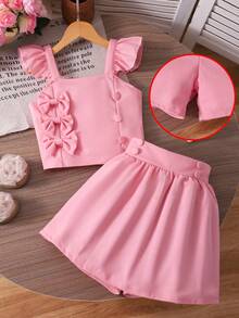 Bộ áo và quần short màu vàng bơ kiểu công chúa ngọt ngào cho bé gái, thích hợp cho mùa xuân/hè, áo tay loe nhiều lớp với khuy cài và nơ, gồm 2 món, phù hợp mặc hàng ngày và các bữa tiệc nhỏ. - Hồng - Xem 8
