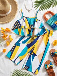SHEIN Playful Pals 两件套女童几何印花宽松吊带背心+裤子，度假风休闲夏季套装。色彩缤纷的几何印花吊带背心套装充满夏日气息，采用舒适柔软的面料，吊带背心搭配宽松阔腿裤，展现可爱俏皮的造型，适合女孩日常穿着、户外活动或夏季家庭聚会。 - 彩色 - 查看 1