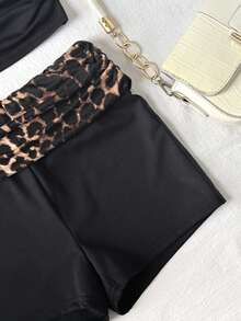 SHEIN Bộ đồ thể thao tối giản, thoải mái, co giãn, màu trơn dành cho bé gái tuổi teen gồm áo tank top và quần short in họa tiết da báo với cạp quần tương phản, màu đen. - màu đen - Xem 4