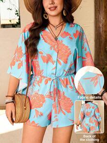 Breezaya Bộ jumpsuit cỡ lớn dành cho nữ, in họa tiết hoa rực rỡ, cổ chữ V màu cam, cài nút gỗ và thắt eo, kiểu dáng thanh lịch, thoải mái, đa năng cho kỳ nghỉ xuân/hè. Bộ đồ đi nghỉ mát cho nữ, quần áo mùa hè cho nữ, bộ 2 mảnh liền thân cho nữ đi nghỉ mát. - Màu xanh lam - Xem 1
