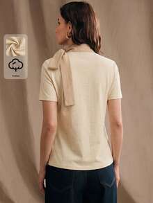Áo thun nữ Anewsta màu mơ, chất liệu cotton pha 74%, cổ bẻ, thắt eo, tay ngắn, ôm dáng, phối vải denim, kiểu dáng thanh lịch, tối giản, phù hợp mặc hàng ngày hoặc đi làm. - Màu be - Xem 3