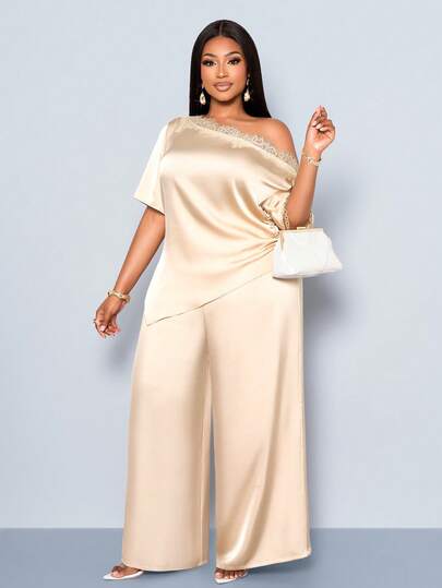 SOLERSUN This Plus-Size Women's Fashion Set Features A Light Apricot Satin Short-Sleeved Blouse And Loose-Fitting Wide-Leg Trousers In A Simple, Elegant Light Apricot Color. The Blouse And Trousers Have An Asymmetrical Neckline And Lace Trim. The Asymmetrical Hem Of The Top Is Tailored To Flatter The Figure, Making It A Versatile And Stylish Choice For Both Work And Leisure Occasions. Perfect For Spring And Summer, Commuting, Shopping, Beach Vacations, Dates, Parties, And Wedding Season.