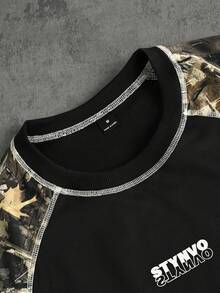 STYNVO 男士舒适卫衣面料短袖T恤和抽绳松紧腰短裤两件套，采用树枝印花拼接纯色面料，搭配优雅字母印花，适合休闲、度假、派对、聚会、运动、办公、春夏等场合，经典日式短袖短裤套装，畅销拼接款，自穿或送礼皆宜。 - 彩色 - 查看 4