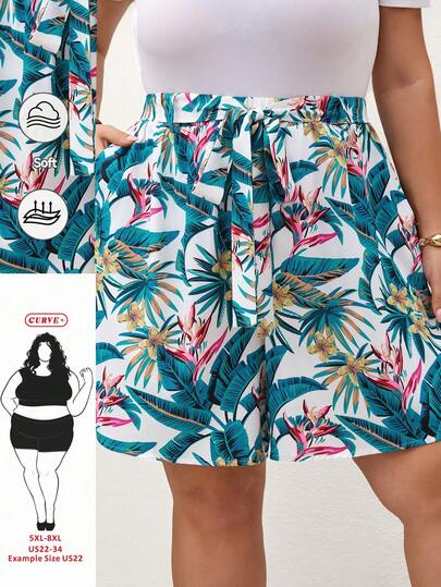 SHEIN CURVE+ Quần short rộng rãi, có túi, in họa tiết cây nhiệt đới dành cho nữ, cỡ lớn, thích hợp cho kỳ nghỉ hè và xuân.