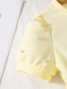 Glamorique Kids Đầm hè thanh lịch cho bé gái màu trơn, cổ tròn, tay áo cánh hoa đính ngọc trai, họa tiết hoa 3D, chất liệu mềm mại, co giãn, thích hợp cho kỳ nghỉ hè 2026, làm từ vải mềm mại, lý tưởng cho du lịch. Có kèm thắt lưng. - Màu vàng - Xem 8