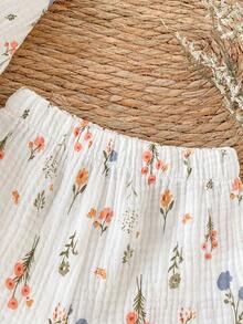 SHEIN Bộ đồ 2 món cho bé gái, chất liệu vải mềm mại, dễ thương, hai lớp, in hoa, cổ tròn, viền bèo nhún và quần short cạp chun, viền bèo nhún, thích hợp cho các hoạt động mùa xuân/hè, kỳ nghỉ, du lịch, chụp ảnh, thoải mái và đa năng. - trắng - Xem 8