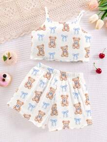 Bộ đồ ngủ bé gái tuổi teen gồm áo hai dây và quần short ôm sát, họa tiết gấu hoạt hình và nơ, thích hợp cho mùa hè. - Nhiều màu - Xem 2