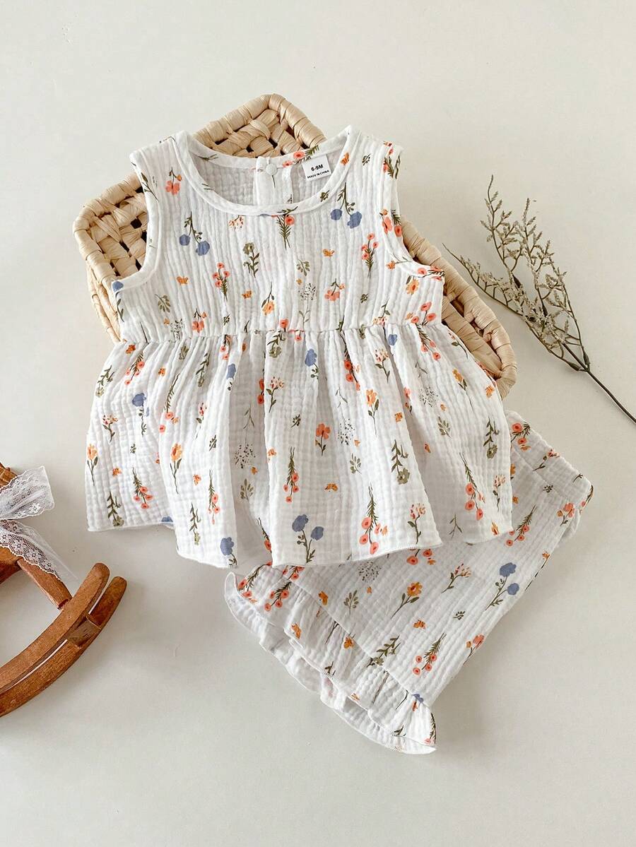 SHEIN Bộ đồ 2 món cho bé gái, chất liệu vải mềm mại, dễ thương, hai lớp, in hoa, cổ tròn, viền bèo nhún và quần short cạp chun, viền bèo nhún, thích hợp cho các hoạt động mùa xuân/hè, kỳ nghỉ, du lịch, chụp ảnh, thoải mái và đa năng. - trắng - Xem 1