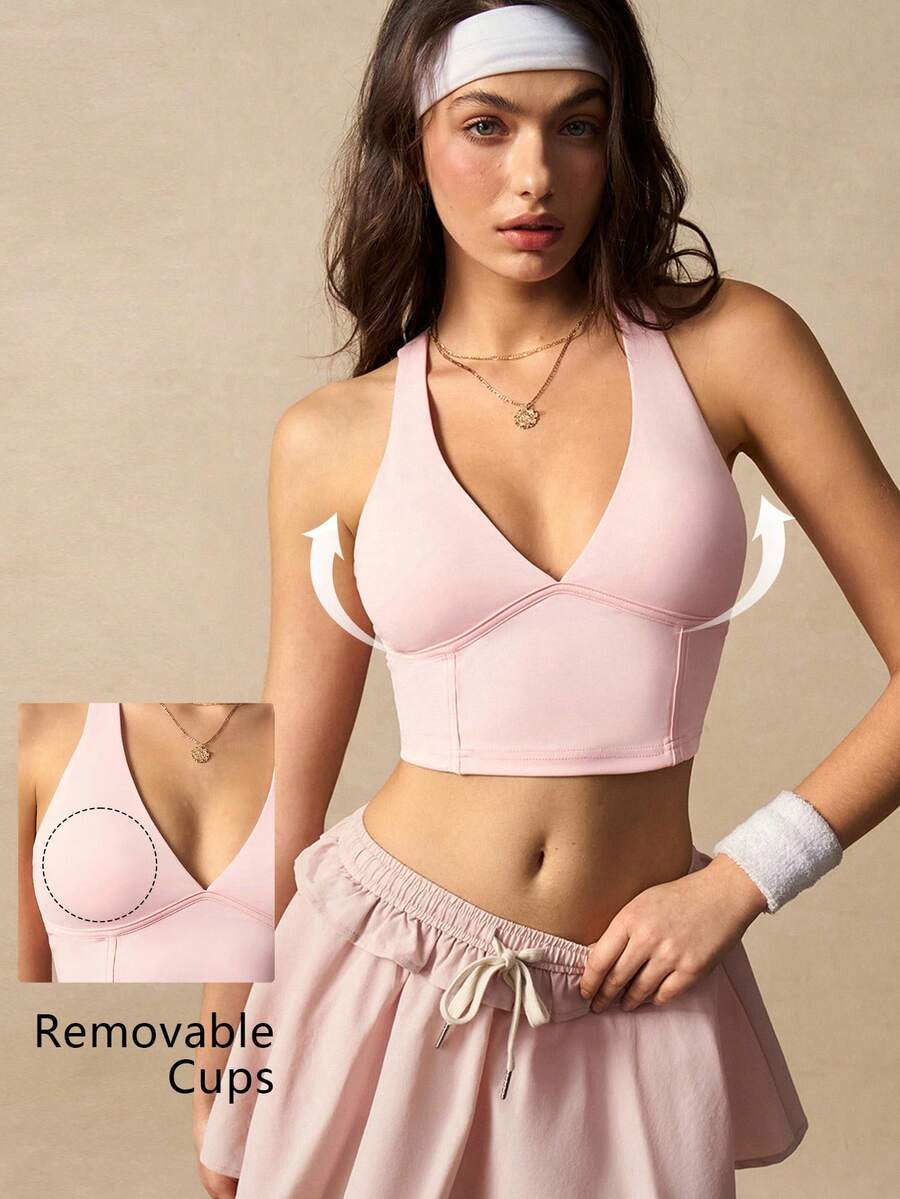 VARSIVA Top deportivo corto sin espalda de unicolor con cuello halter