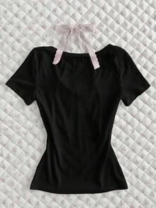 Flirla Camiseta ajustada de manga corta con volantes, parches de color contrastante y lazo, de estilo estriado blanco. Prenda versátil y elegante para uso diario, oficina y viajes, ideal para primavera/verano - Negro - Ver 2