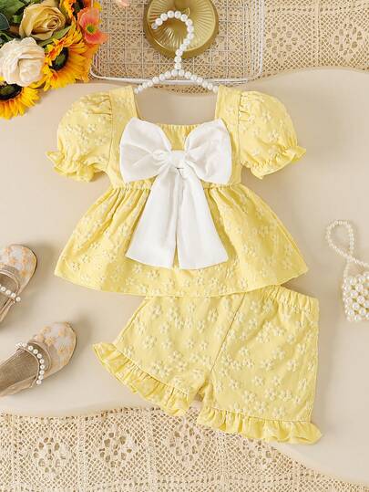 SHEIN Baby Girl Sweet Cute Puff Sleeve White Top With Big Bow Decor + Ruffle Hem Yellow Shorts Set