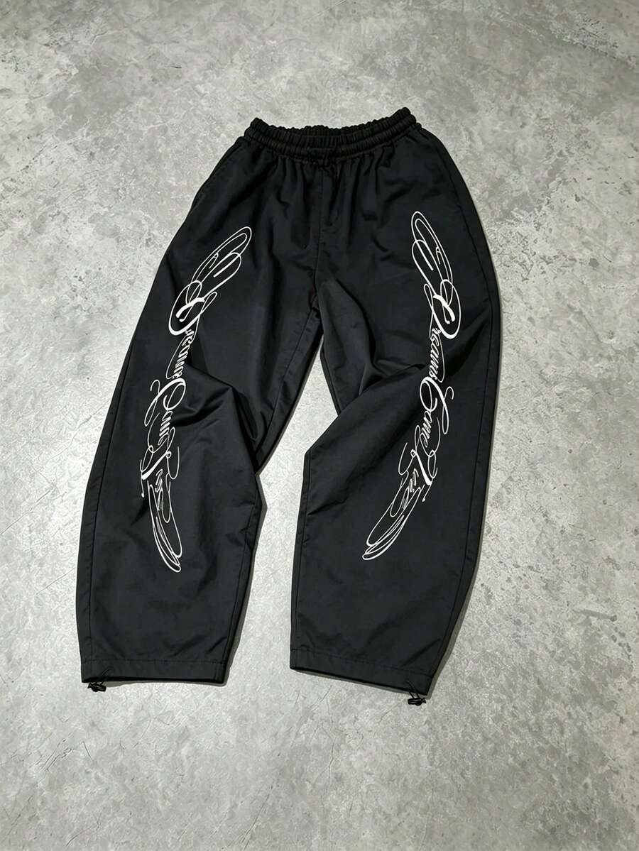 Sport MetroGents Pantalones de chándal holgados con cintura elástica y estampado de letras para hombre - Negro - Ver 1