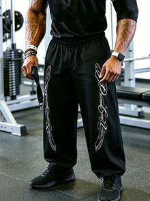 Sport MetroGents Pantalones de chándal holgados con cintura elástica y estampado de letras para hombre - Negro - Ver 4