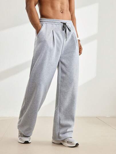 Driftmere Pantalones de chándal casuales sueltos con cintura con cordón y bolsillos para hombre