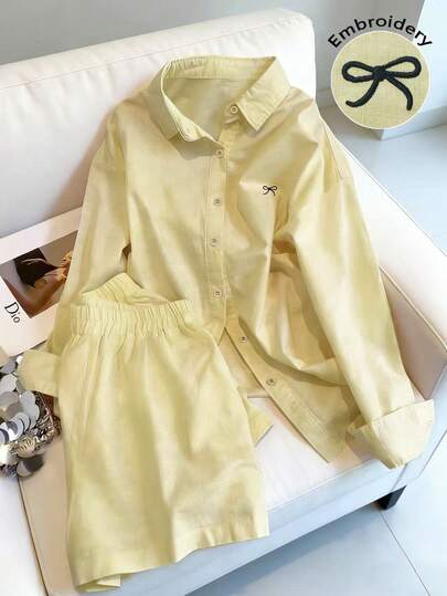 Resyla Bộ đồ nữ gồm áo tay dài cài cúc đơn, thêu họa tiết nơ và quần short, kiểu dáng thường ngày.