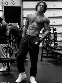 GymBeat Pantalones deportivos con cordón en la cintura y estampado de letras, versátiles para hombres - Negro - Ver 1