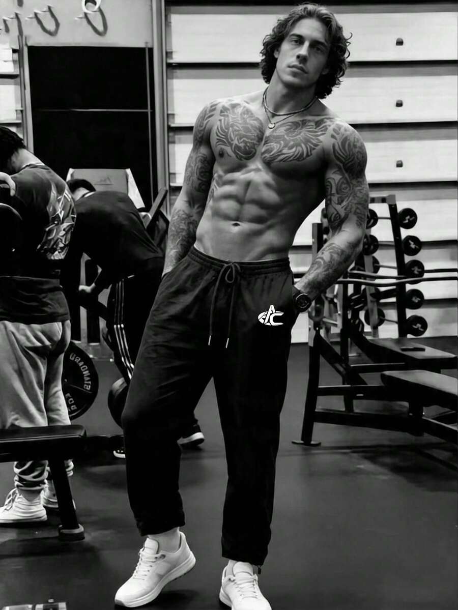 GymBeat Pantalones deportivos con cordón en la cintura y estampado de letras, versátiles para hombres - Negro - Ver 1