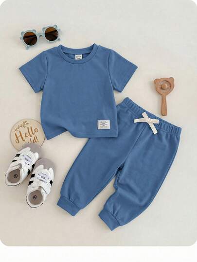 Baby Boy/Girl Green Spring/Summer Soft & Stretchy Fabric Decorative Knitted Crew Neck Short Sleeve Top And Elastic Waist Pants 2-Piece Set, Suitable For Outings, Vacation, School, And Home