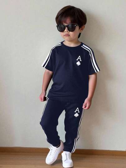 SHEIN 2pcs/Set Kids Tween Boys Casual Versatile Printed Pattern Mixed Thick And Thin Ribbed Round Neck Short Sleeve T-Shirt And Jogger Pants Knit Outfit,Boy Clothes,Sweatpants,Boys Summer Clothes ,Outfit Sets,School Tops,Back To School Clothes Boys,Black Graphic T Shirt,Fall Pants