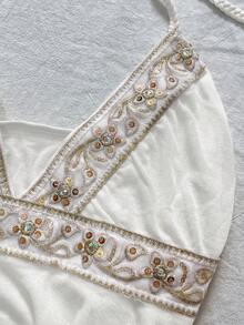 IslaSuriya Sequin Embroidered Ribbon Decor Asymmetric Hem Backless Halter Neck Top For Women - White - View 4