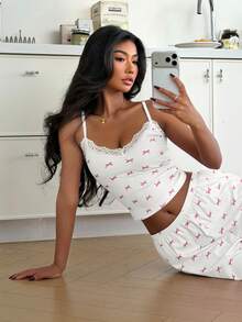 ZzzCrew Conjunto de ropa de dormir para mujer, con estampado de lazos rosados y pantalones largos con ribete de encaje y camiseta de cuello en V - Blanco - Ver 7