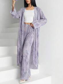 Bộ 2 món gồm áo dài tay in họa tiết toàn thân và quần cạp chun cho nữ. - Nhiều màu - Xem 4