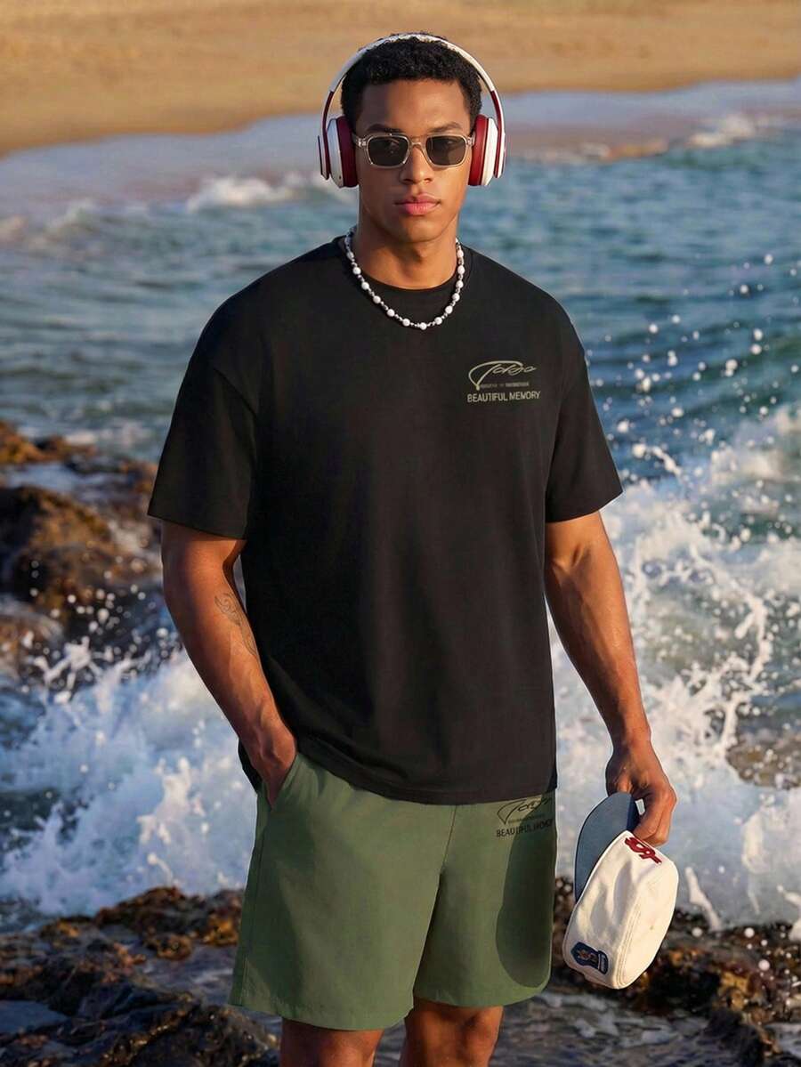 Manfinity EZcore Set casual da uomo taglie forti, composto da maglietta a maniche corte con stampa slogan e collo rotondo, e pantaloncini - Multicolore - Visualizzare 1