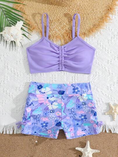 SHEIN Tween Girls Bikini Sets,Girls' Swimsuit Set, Casual, Vacation Style, Purple Swimsuit With Tropical Floral Print, Knitted Fabric, Pleats At The Chest, Bow Decorations On Both Sides Of The Bottoms, Solid Color Top With Shoulder Straps Paired With Printed Shorts, Fashionable, Casual, Exquisite, Gorgeous, And Ladylike Swimsuit Set, Suitable For Swimming, Summer Vacation, Beach, Seaside, Swimming Pool, Summer Party, Leisure And Vacation.