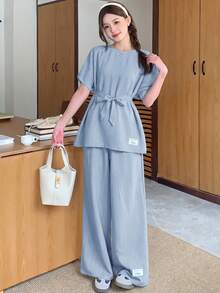 SHEIN Bộ đồ 2 mảnh dành cho nữ tuổi teen, gồm áo sơ mi dệt họa tiết, dáng rộng, vai rớt, thắt eo, in chữ và quần ống rộng, thích hợp cho mùa xuân/hè, dã ngoại mùa xuân, đi chơi thường ngày, dạo phố, đi nghỉ mát, đi học, các ngày lễ, dã ngoại gia đình mùa xuân, và mặc hàng ngày. - Màu xanh nhạt - Xem 9