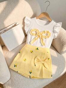 Elladie kids Bộ đồ thường ngày 2 món cho bé gái: Áo cổ tròn ôm dáng mềm mại, dáng suông, phối vàng và trắng kẻ caro, tay bồng, nơ, gồm áo vàng chanh và quần kẻ caro có nơ. - Màu vàng - Xem 6