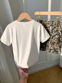 SHEIN 2pcs Young Boys White Summer Set,Casual Cute Graffiti Cartoon Pattern Round Neck Short Sleeve T-Shirt And Shorts Knit Set,Toddler Kids Outfits,School - Multicolor - View 3