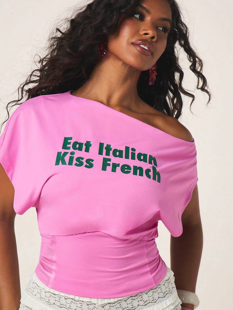 MISSGUIDED Asymmetric Off-Shoulder Slogan Top With Green Text Print Short Sleeve Pink Women's Casual Summer Statement Tee