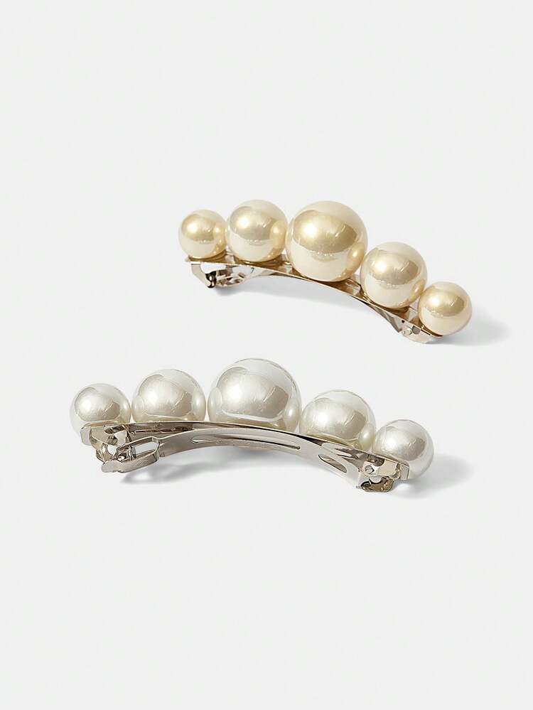 2 PEARL HAIRPINS.