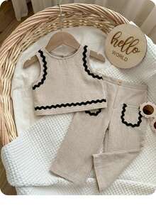 SHEIN Bộ đồ 2 mảnh dễ thương cho bé gái, gồm áo vest và quần kaki đơn giản, đáng yêu, được trang trí bằng ruy băng, phù hợp cho các bữa tiệc sinh nhật, tiệc tối, biểu diễn, đám cưới, lễ rửa tội, lễ khai trương, mặc hàng ngày, đi học, dã ngoại và mùa xuân/hè. - Màu Khaki - Xem 1