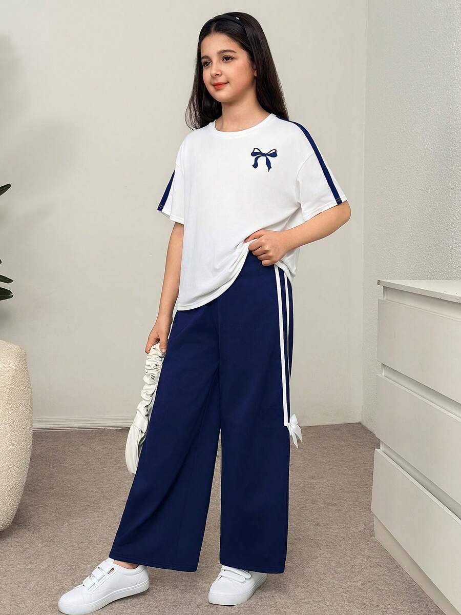 SHEIN Bộ đồ thể thao 2 món cho bé gái tuổi teen, kiểu dáng retro, tay raglan rộng thùng thình, phối màu tương phản, in nơ, cổ tròn và quần nỉ ống đứng, màu xanh & trắng. - Xanh và trắng - Xem 1