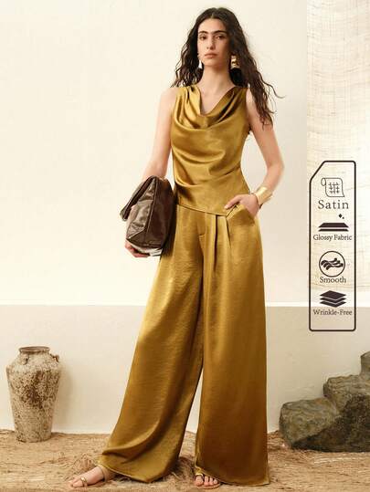 Arave Bộ đồ nữ gồm áo không tay xếp ly cổ rủ bằng vải satin và quần ống rộng cạp cao, thích hợp cho cả mặc hàng ngày và đi làm.