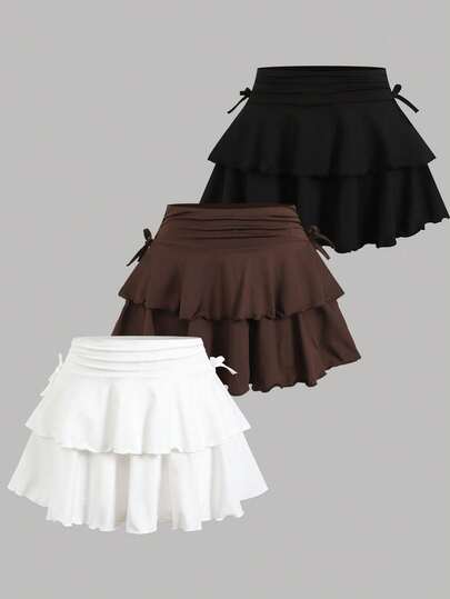 SHEIN Bộ đồ thể thao cho bé gái tuổi teen, mua 1 tặng 2: váy và quần short dệt kim màu trơn.