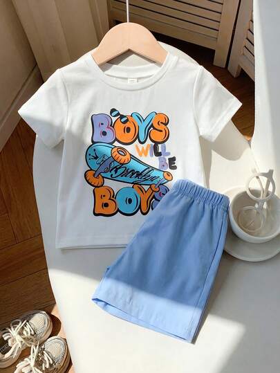SHEIN 2 ชิ้น ชุดเสื้อยืดแขนสั้นพิมพ์ลายการ์ตูนบาสเกตบอลและกางเกงขาสั้นสีม่วงเอวยางยืดสำหรับเด็กผู้ชาย