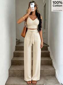 SHEIN PariChic Bộ đồ 2 món dành cho nữ màu mơ, chất liệu 100% cotton, gồm áo hai dây nâng ngực có nơ và quần ống đứng co giãn, thích hợp cho kỳ nghỉ biển. Bộ đồ đi nghỉ mát mùa xuân/hè mới, gồm áo hai dây có nơ và quần ống đứng thoải mái, chất liệu cotton 100%, 100% cotton, kèm áo hai dây nâng ngực có nơ và quần ống đứng co giãn. - Màu be - Xem 6