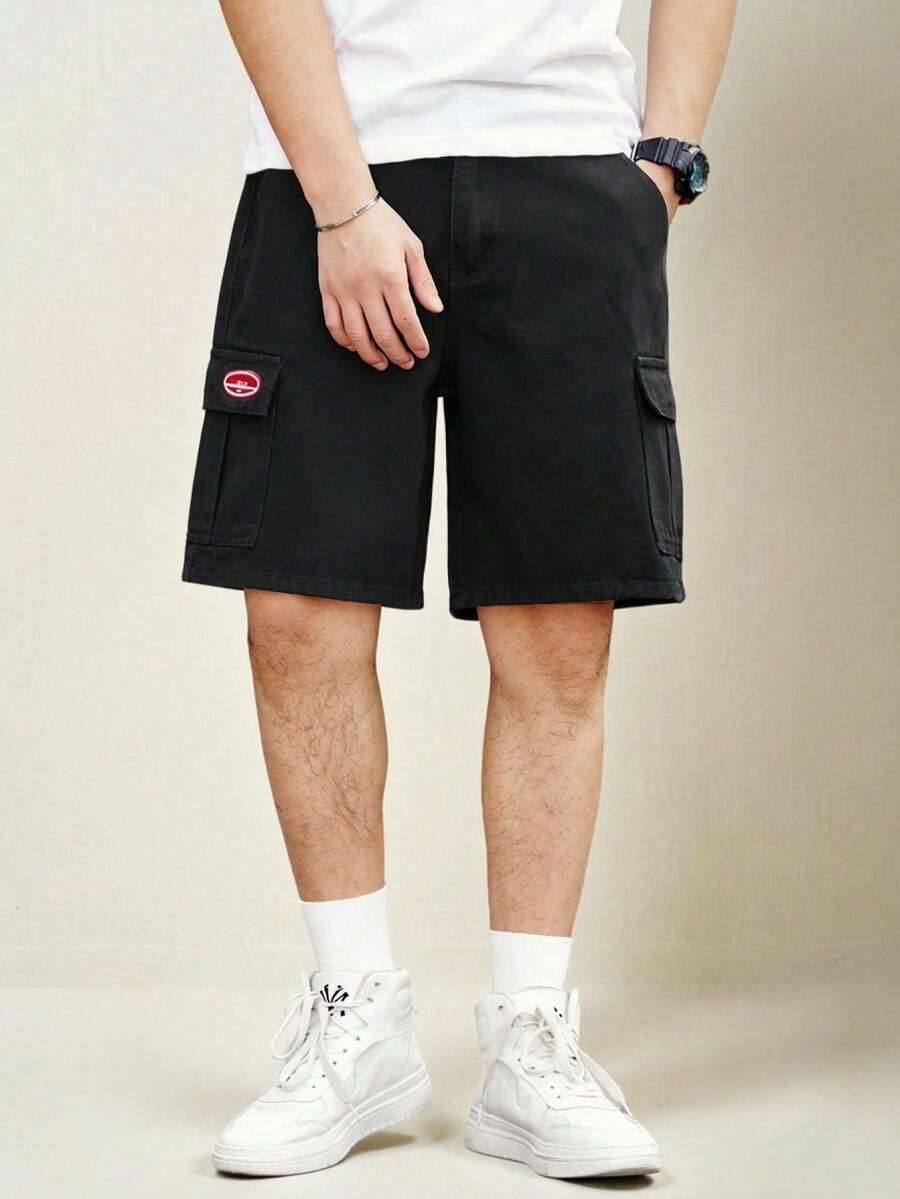 Manfinity Homme Shorts de mezclilla holgados para hombres con parches de letras y bolsillos con solapa, jorts holgados negros lisos para salir de moda rapero - Negro - Ver 1
