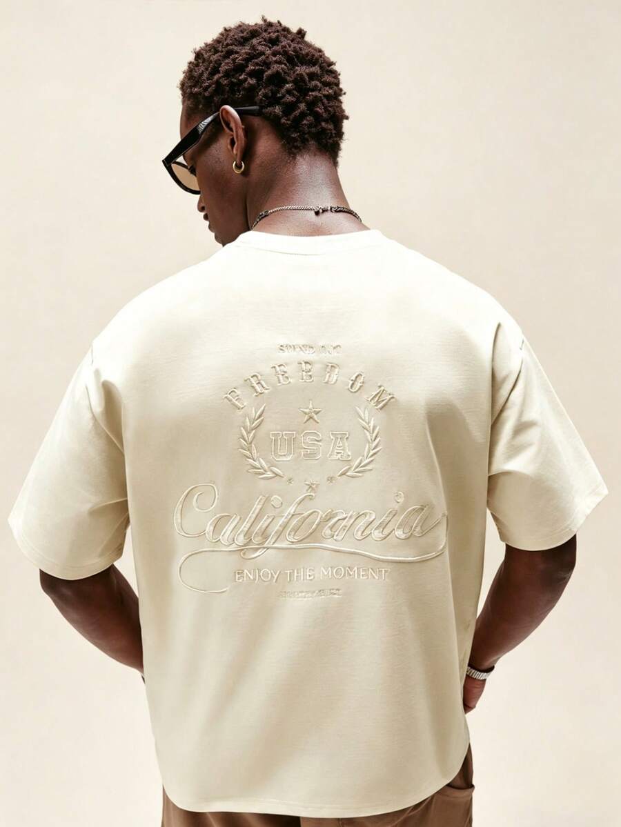 STYNVO Men's Round Neck Embroidered Short Sleeve T-Shirt, Suitable For Daily Life, Travel And Outdoor Wear, Spring/Summer - Apricot - View 1